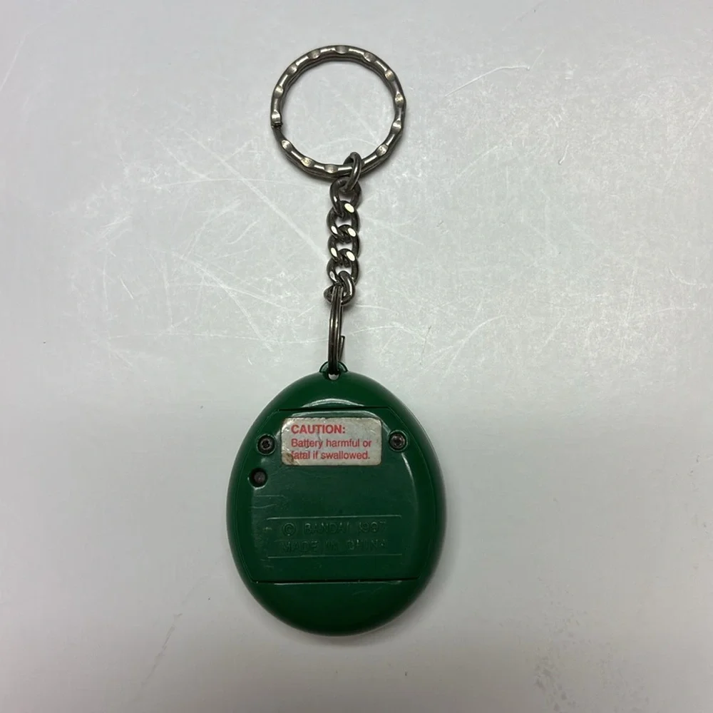 Tamagotchi English Green & Yellow 1997 Bandai Virtual Pet keychain